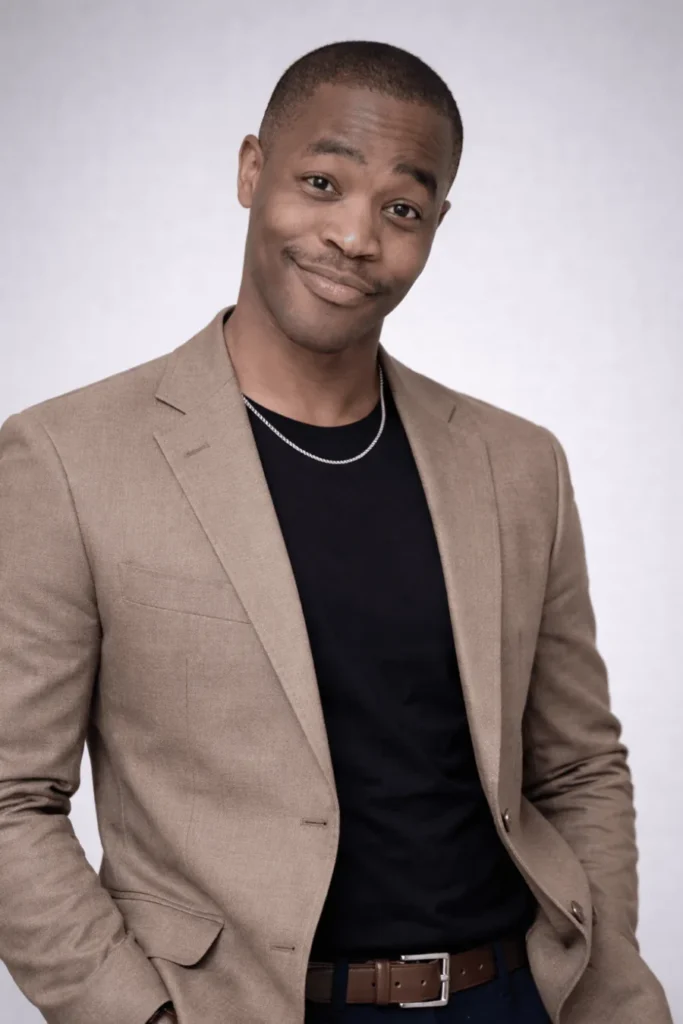 Davian, creator of Storytelling Power, wearing a beige jacket